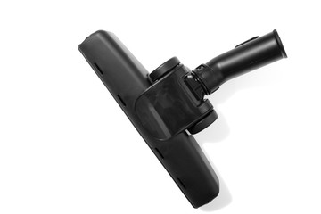 Black brush head for vacuum cleaner on white background.