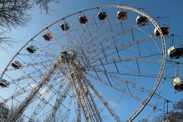 Ferris carousel against the blue sky without people