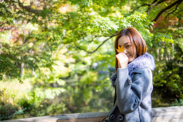 Lovely Asian girl in style of japanese lady with acting smile on portrait photo.