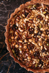 Walnut cake, five kinds of nuts, vegetarian dessert. Macro shooting.