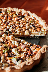 Walnut cake, five kinds of nuts, vegetarian dessert. Macro shooting.