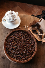 Chocolate cake cafe, nut cake with caramel. Coffee pause.