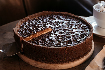 Chocolate cake cafe, nut cake with caramel. Coffee pause.