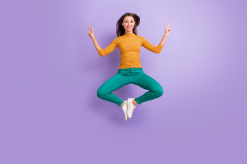 Full length body size view of nice attractive lovely cheerful cheery glad positive girl jumping meditating soul self-development showing v-sign isolated on violet purple lilac pastel color background