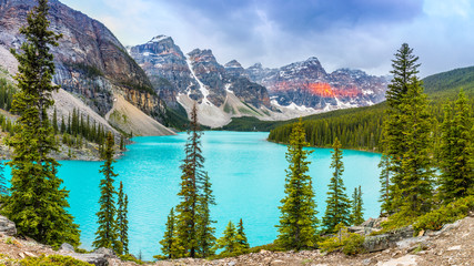 Moraine Lake with nicely illuminaten mountains in the back, Alberta, Canada