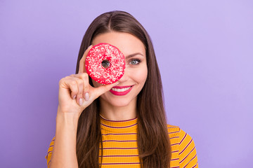 Close-up portrait of her she nice attractive lovely cheerful cheery funny girl holding in hand doughnut like monocle view watch isolated over violet purple lilac pastel color background