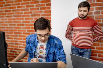 Developing programming and coding technologies. Website design. Programmer working in a software...