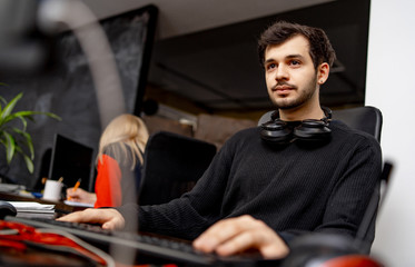 startup business, software developer working on computer at modern office