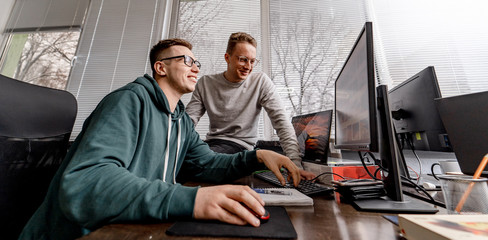 Software engineers working on project and programming in company. Startup team