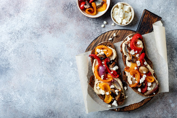 Roasted vegetables toast with hummus and feta cheese