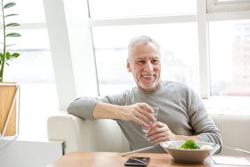 Senior grey-haired bearded businessman