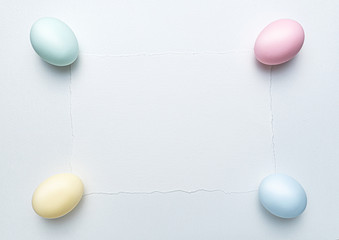 Easter background for greeting card and Easter sale announcement. Easter eggs on watercolor paint paper