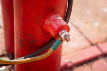 Voltage grounding system on metal structure that used as safety device to transfer leaked electricity current out to earth pit. Safety equipment in industrial operation, close-up and selective focus.