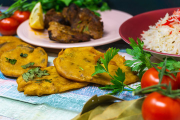 Traditional Indian food chicken tandoori and Tikka with garlic naan