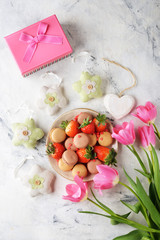 Sweets, strawberries and tulips