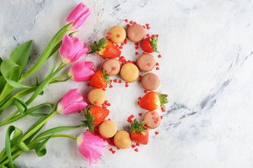 Obraz na płótnie Canvas Sweets, strawberries and tulips
