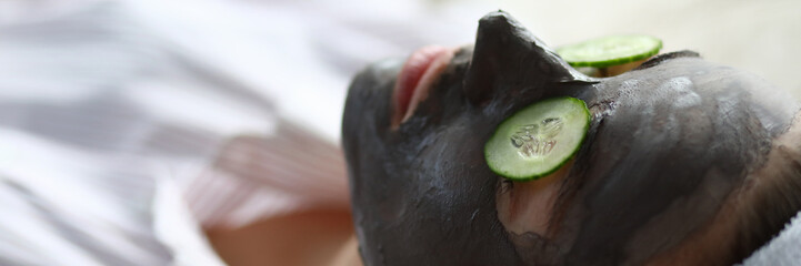 Beaty woman applied chocolate mask in spa salon facial portrait. Heath skin care concept. Look at camera person