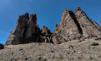 The amazing badlands and palisades of the John Day Fossil Beds clarno unit and rock formations in a semi desert landscape in Oregon State