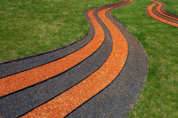 Design of the flowerbed in the form of St. George's ribbon filled with colored stones in memory of...