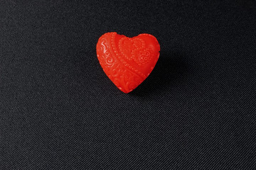 One little red heart made of soap in the dark