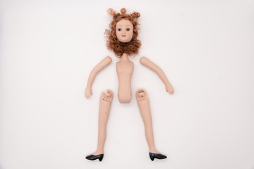Broken Doll Body Parts on white Background