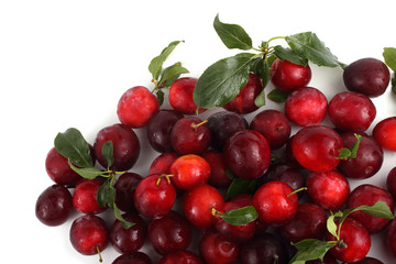 Red plums with leaves isolated on white