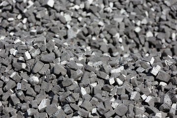 A scattering of gray slag on a sunny day.