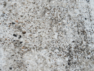 Asphalt texture with a little snow on the surface.