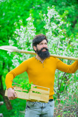 Gardening tools. Work in garden. Bearded man with gardening spade. Gardener work. Farm. Work in garden. Spring. Smiling man preparing to planting. Plants. Shovel.