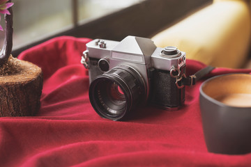 An old analog camera and coffee concept
