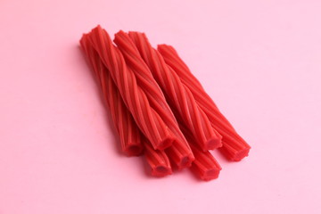 sweet red gummy licorice in color background