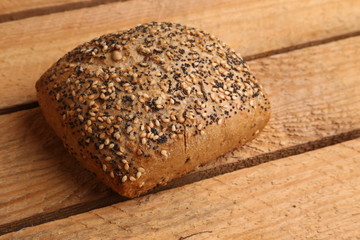 delicious bread rolls on colored background