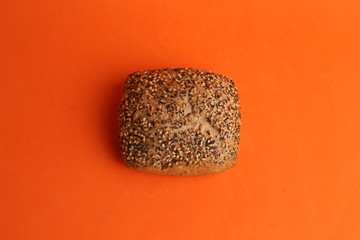 delicious bread rolls on colored background