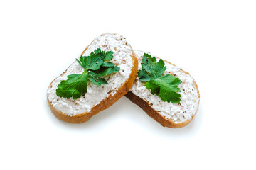 White pate spread on two slices of bread and decorated with parsley, gentle pink background