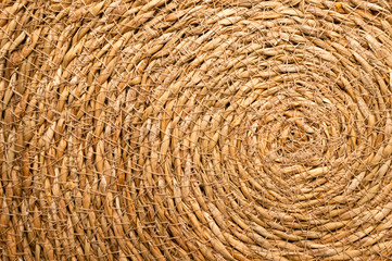Close Up of a Round Esparto Grass Mat, Natural Fiber Background.