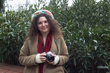 Curly haired photographer woman posing for the camera © denizbayram