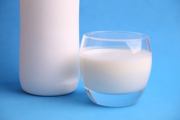 liquid yogurt bottle in color background