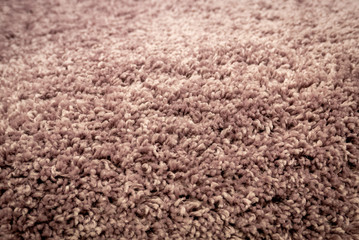 Close up view of carpet. Wall-to-wall carpeting background.