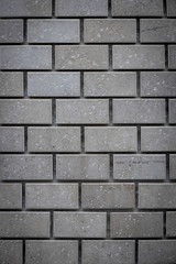 Gray ceramic bricks on the wall as background