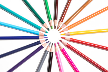 circle of colored pencils isolated on white background
