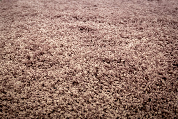 Close up view of carpet. Wall-to-wall carpeting background.