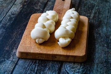 Turkish Knitting / Knitted Cheese on Wooden Board.