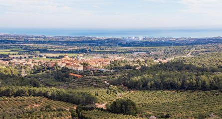 Fototapeta premium Panoramic view of Mont-roig and the Costa Dorada seen from the Sanctuary of La Mare de Deu of Roca, Catalonia, Spain