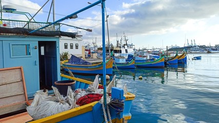 Fototapeta na wymiar fishing boats in a harbor of Malta