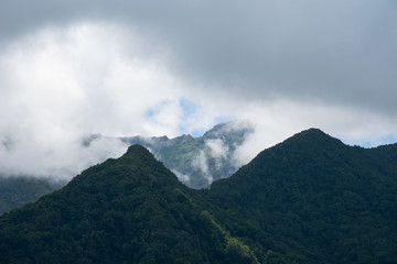 Obraz na płótnie Canvas mountains and clouds photo wallpaper