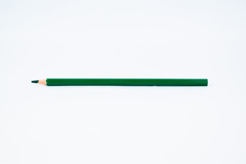 Green wood pencil crayon with sharp tip isolated on a white background