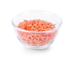 Dried small shrimp in glass bowl isolated on white background.