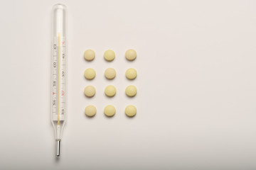 medical thermometer and pills