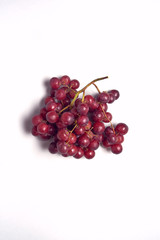 Overhead View Of Bunch Of Red Grapes On White Background