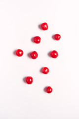 Overhead View Of Individual Fresh Tomatoes On White Background